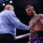 Massive brawl breaks out after boxing disqualification over controversial bell punch
